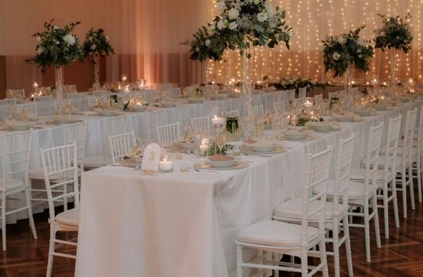 Long wedding tables with candles and flowers