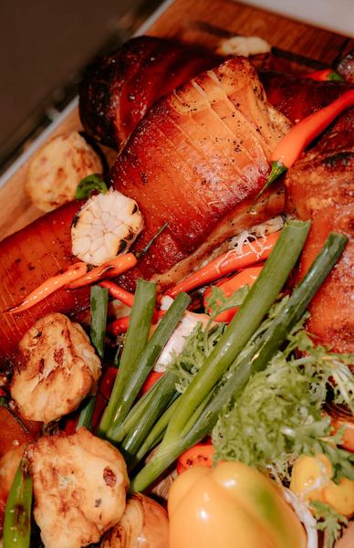 Close-up of roast meat with grilled vegetables