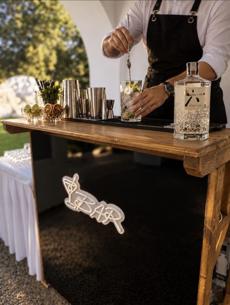 Bartender mixing a drink at the mobile bar