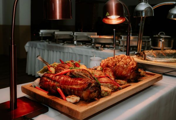 Roast meat on a board at the hot buffet
