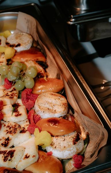Grilled cheese, fruit and bread on the buffet