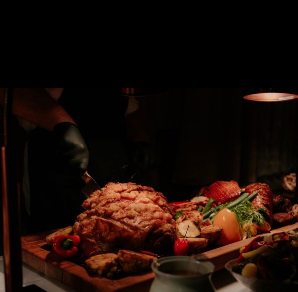 Carving roast meat on the board