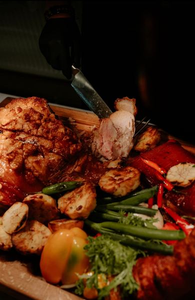 Carving roast meat with vegetables