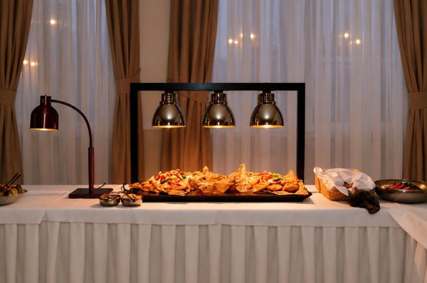 Hot buffet under heat lamps ready for the reception