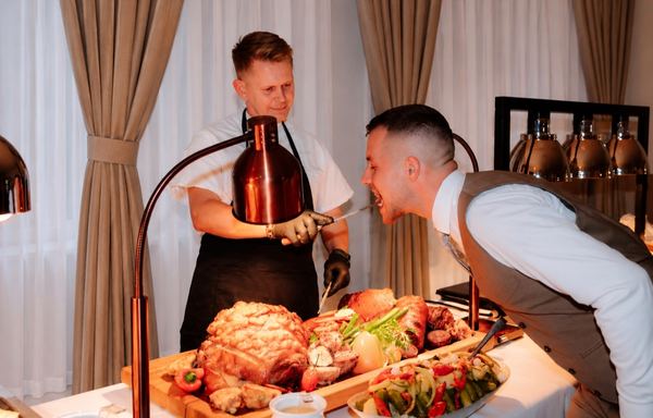 Carving roast meat at the buffet