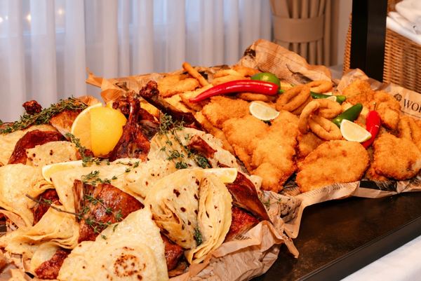 Fried schnitzels, calamari and flatbreads on the buffet